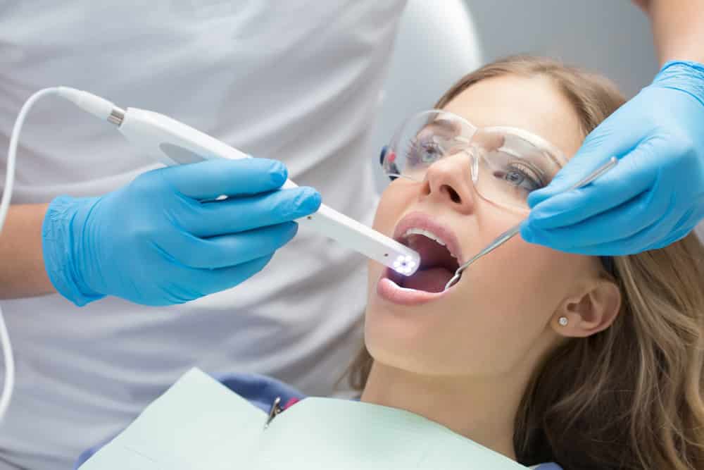 Dentist Using Articulator — Dentist Cardiff