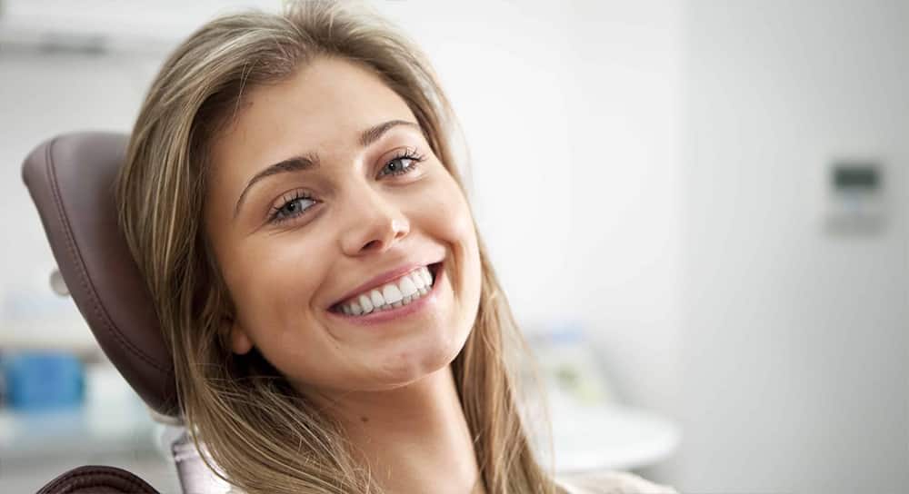 Smiling After Tooth Veneers — Dentist