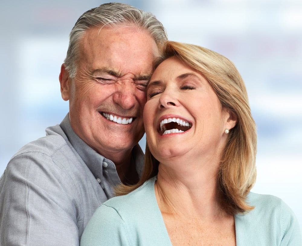 Senior Couple Smiling — Dentures in Newcastle, NSW