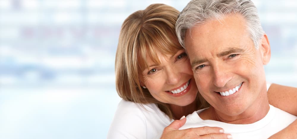 A smiling senior couple With Healthy Teeth