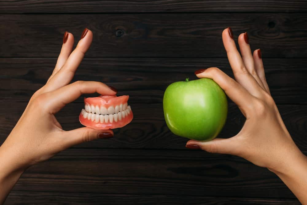 Denture And Apple